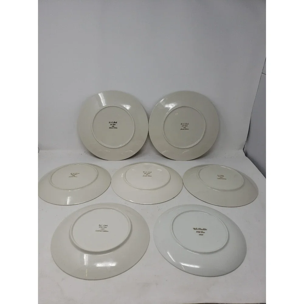 B. C. CLARKS Set of 7, 77th 80th 90th 91st 92nd 97th & 101st Christmas Plates